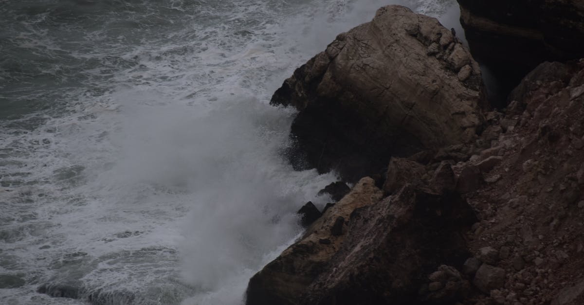 How do I pass the first wave on hard? - Brown Rock Formation Near Body of Water