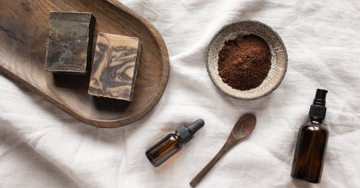 How do I perfect my gemology? - Top view of coffee scrub in bowl composed with bottles of aromatic oil on white sheet How do I perfect my gemology? - Top view of coffee scrub in bowl composed with bottles of aromatic oil on white sheet