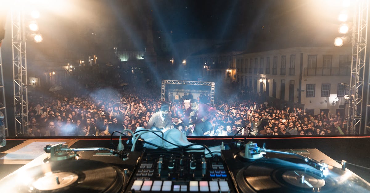 How do I perform something like rolling the controller shock button on keyboard properly? - DJ console at stage with crowded audience