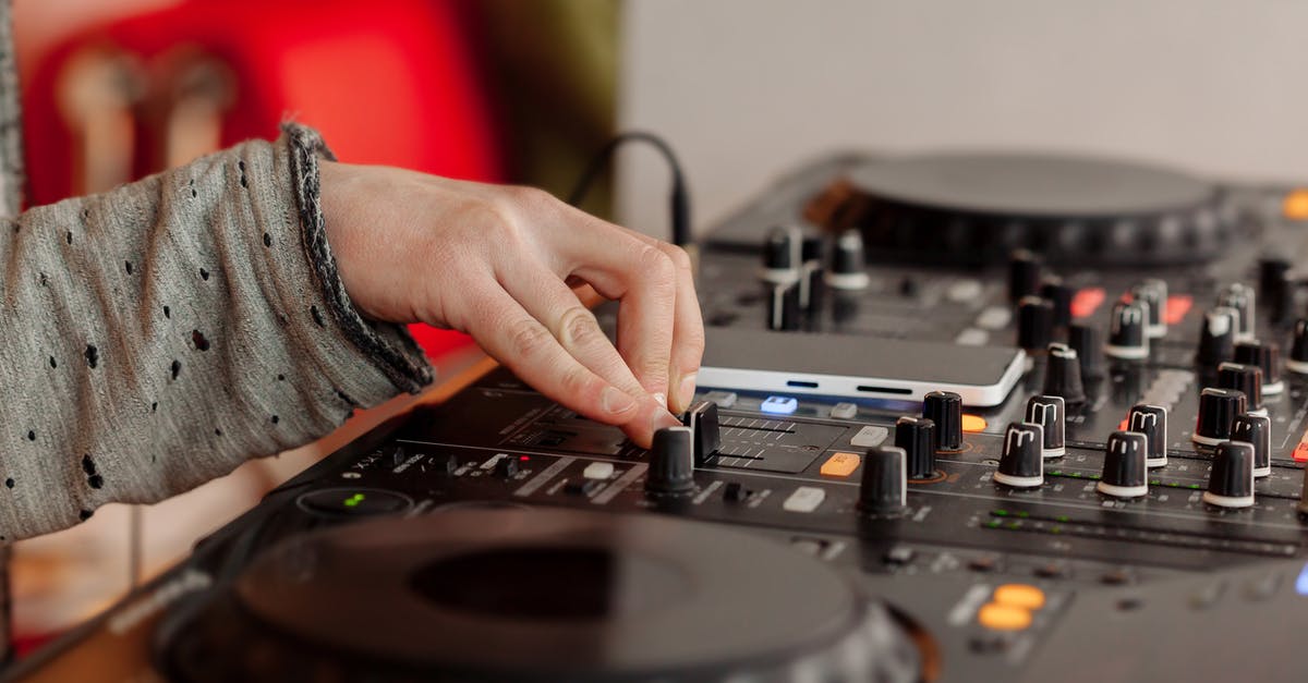 How do I perform something like rolling the controller shock button on keyboard properly? - DJ playing music at mixing console