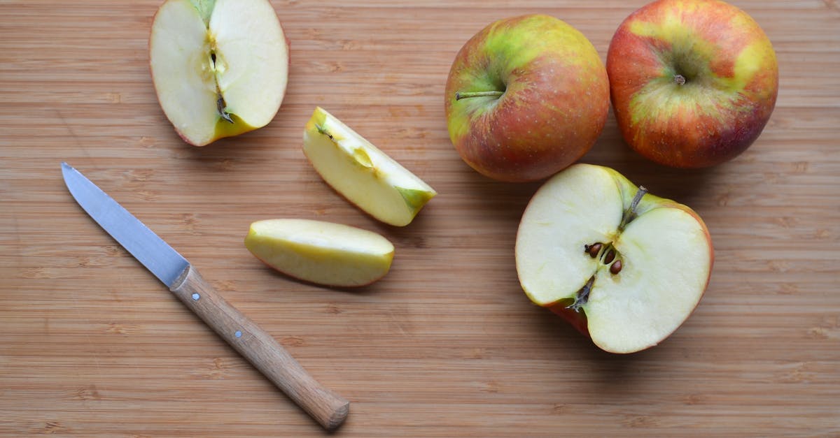 How do I place a specific piece of furniture? - Slices of ripe apples and knife on wooden surface How do I place a specific piece of furniture? - Slices of ripe apples and knife on wooden surface