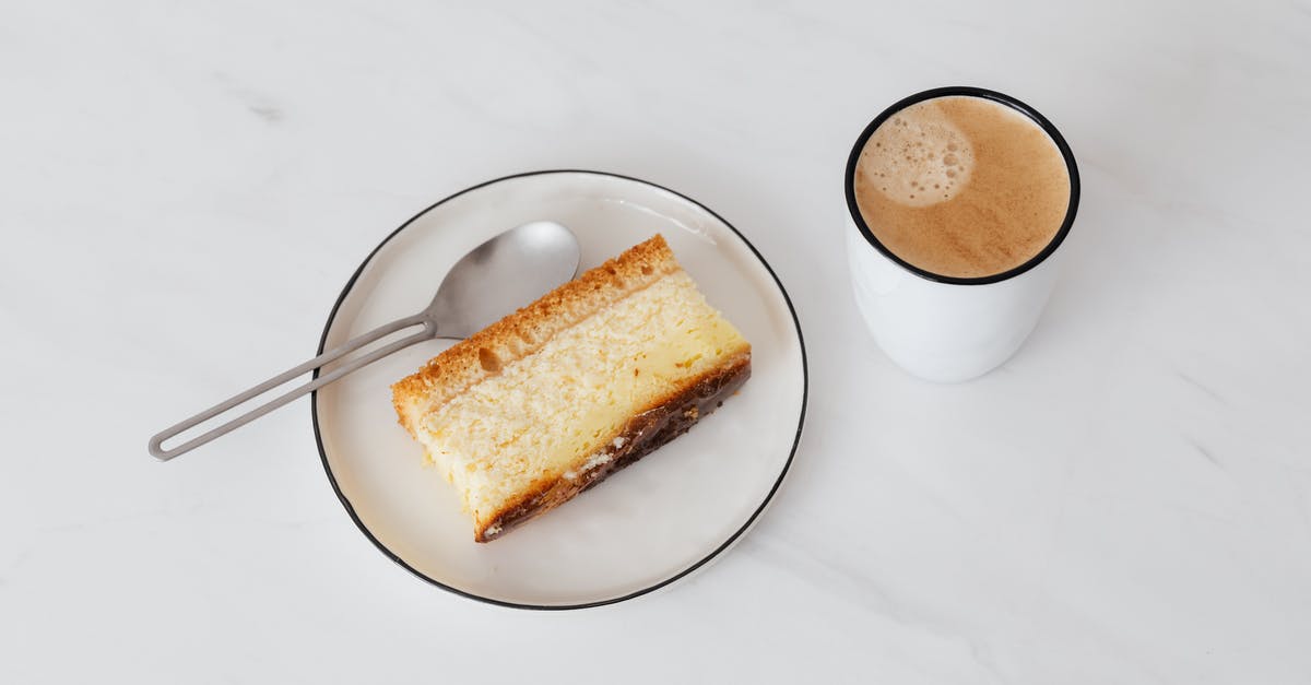 How do I place a specific piece of furniture? - From above of cup of hot coffee near white plate with delicious piece of cake placed on white marble tabletop How do I place a specific piece of furniture? - From above of cup of hot coffee near white plate with delicious piece of cake placed on white marble tabletop