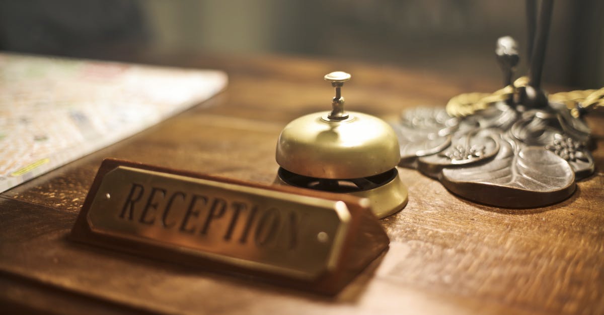 How do I place blocks out of blockspaces? - Old fashioned golden service bell and reception sign placed on wooden counter of hotel with retro interior