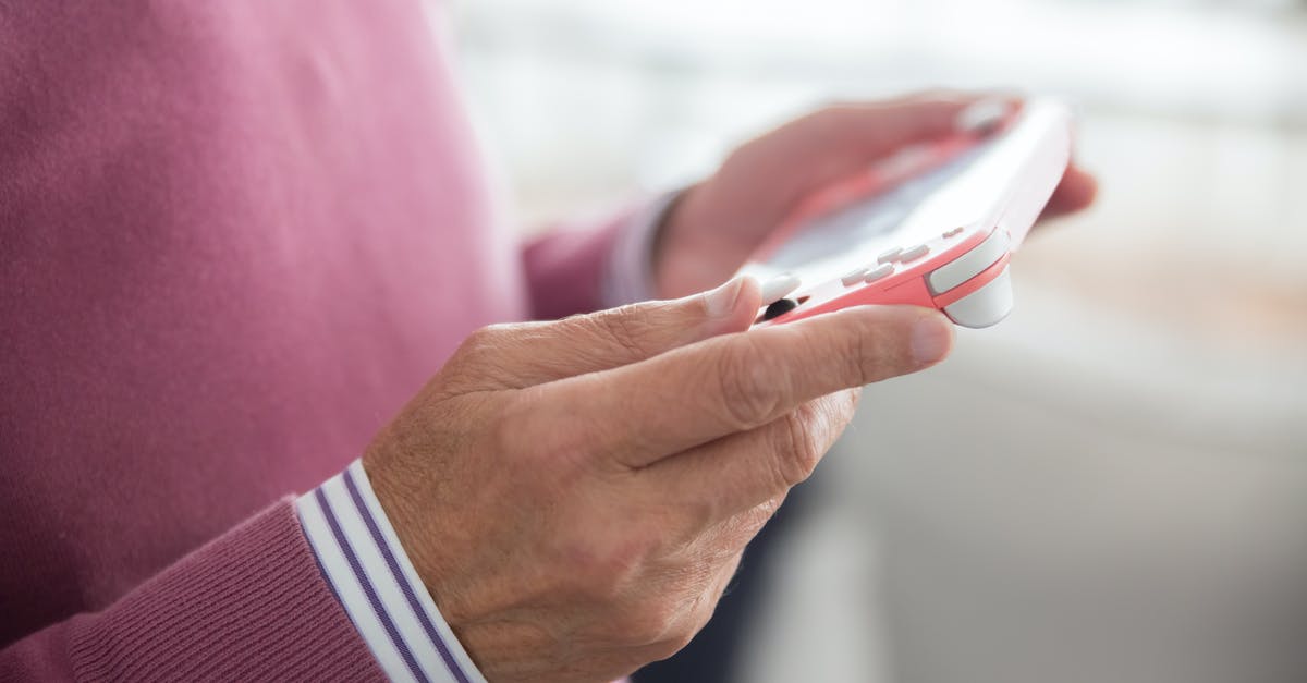 How do I play Minecraft Hunger Games on Pocket Edition? [closed] - A Person Playing A Game Console