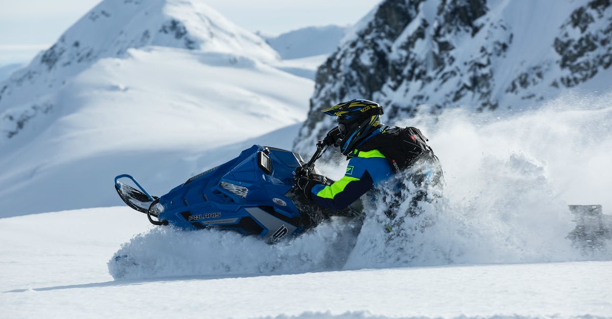 How do I play Mountain on linux? - Person Riding on Snowmobile