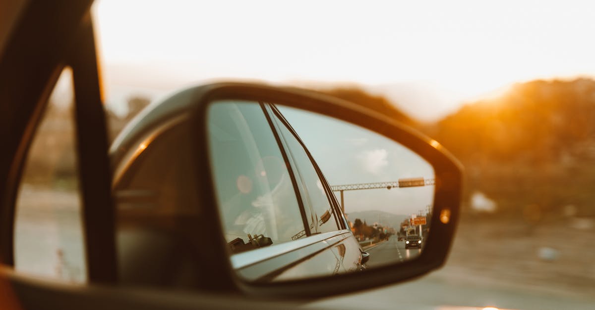 How do I predict when a car will blow up? - Car Side Mirror With Reflection of Sun