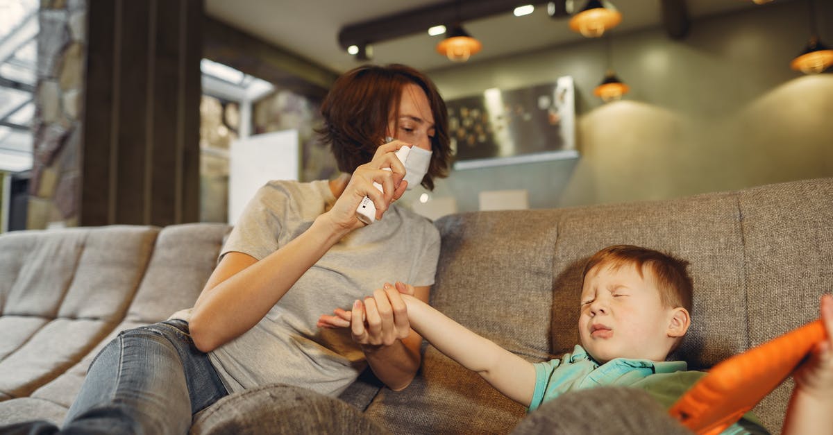 How do I prevent my imbecile son from being an heir? [duplicate] - Mother with spray taking hand of wrinkled son at home