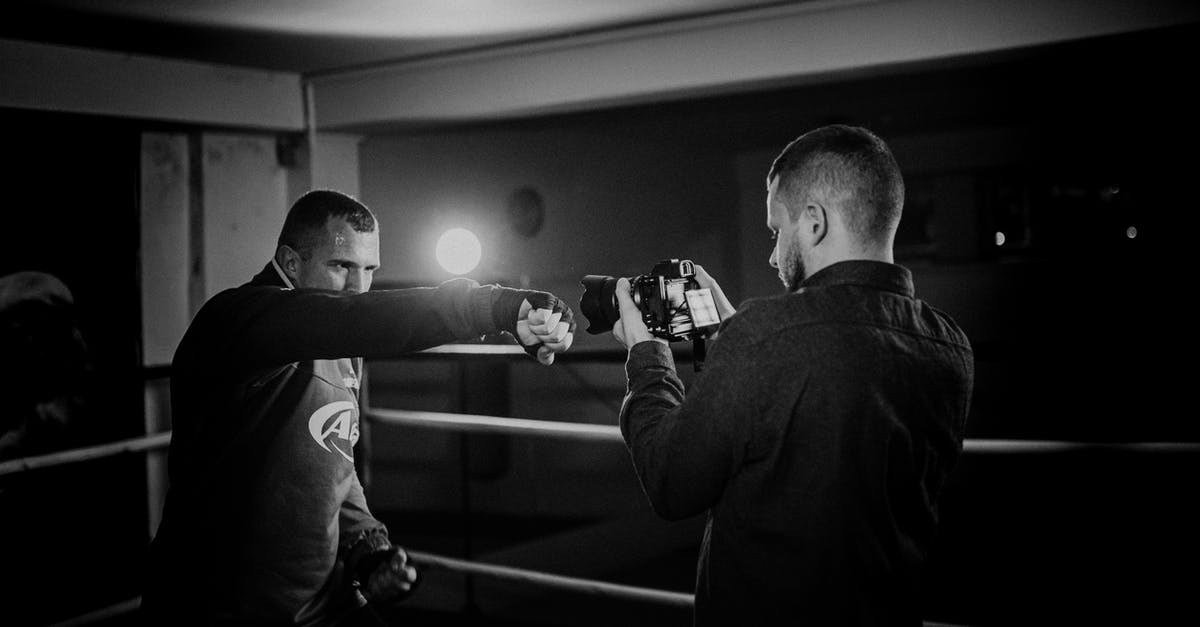 How do I punch enemies instead of using a melee weapon? - Powerful boxer showing punch technique against friend with camera How do I punch enemies instead of using a melee weapon? - Powerful boxer showing punch technique against friend with camera