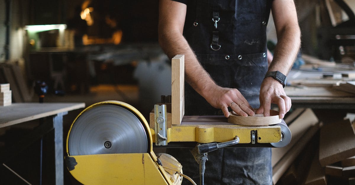 How do I "polish" a piece of equipment? - Crop carpenter shaping wooden detail with grinding machine How do I "polish" a piece of equipment? - Crop carpenter shaping wooden detail with grinding machine