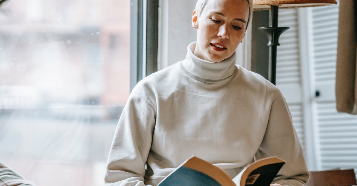 How do I read the stats on article pages on the Magic: The Gathering Website? - Woman reading interesting book near window How do I read the stats on article pages on the Magic: The Gathering Website? - Woman reading interesting book near window