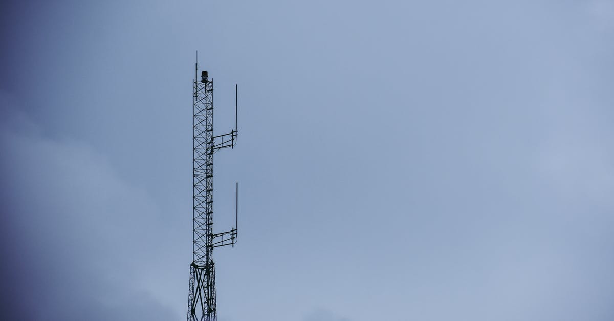 How do I reconfigure the transmitter for Powering Up? - Black Metal Tower Under Gray Sky