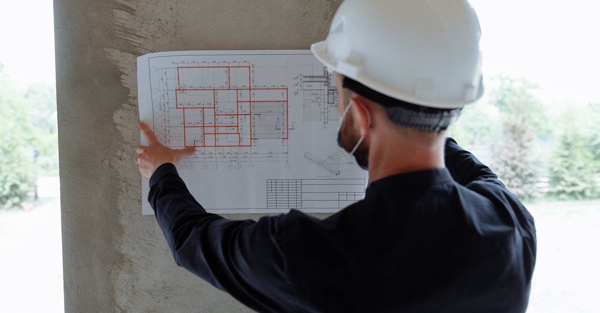 How do I recover a corrupted Prison Architect savegame? - Backview of an Engineer holding a Floor Plan on a Wall How do I recover a corrupted Prison Architect savegame? - Backview of an Engineer holding a Floor Plan on a Wall