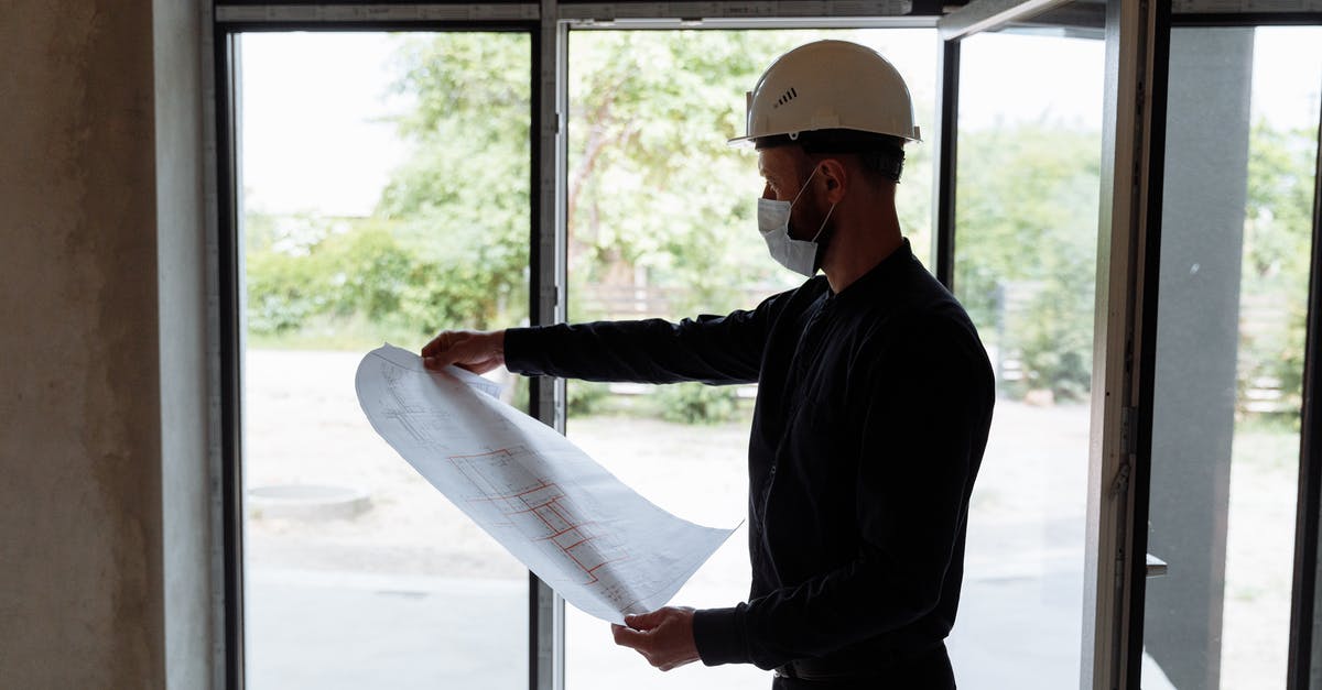 How do I recover a corrupted Prison Architect savegame? - Engineer looking on a Floor Plan How do I recover a corrupted Prison Architect savegame? - Engineer looking on a Floor Plan