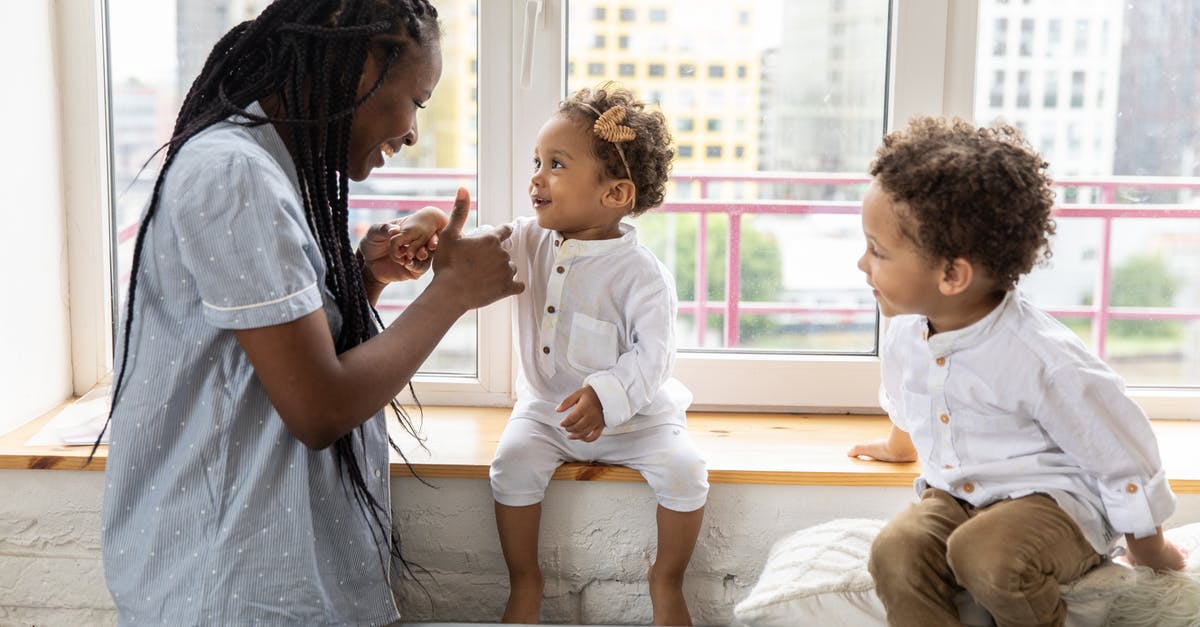 How do I re-enable the windows key while playing a game? - Mother Playing With Her Children Sitting on Windowsill