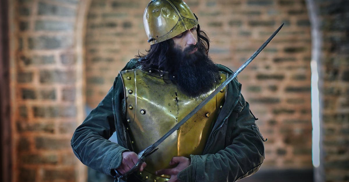 How do I remove Armor Vest? [duplicate] - Man in Black Leather Jacket Wearing Gold Helmet Holding Black and Silver Sword