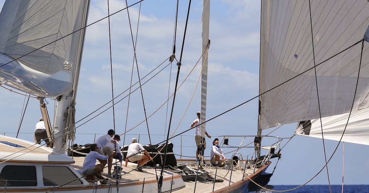 How do I repair a damaged sailing boat? - People Riding on White Sail Boat