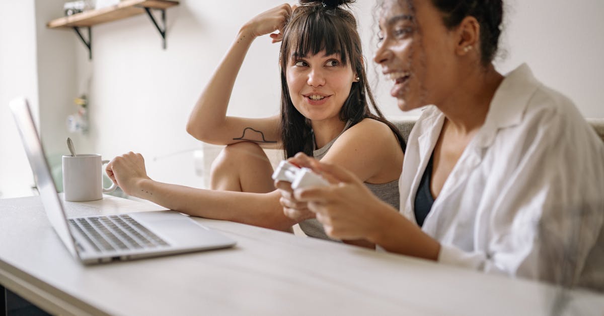How do I respec mid-game in Fallout 4? [duplicate] - A Woman Sitting Beside a Woman Playing Computer Game 