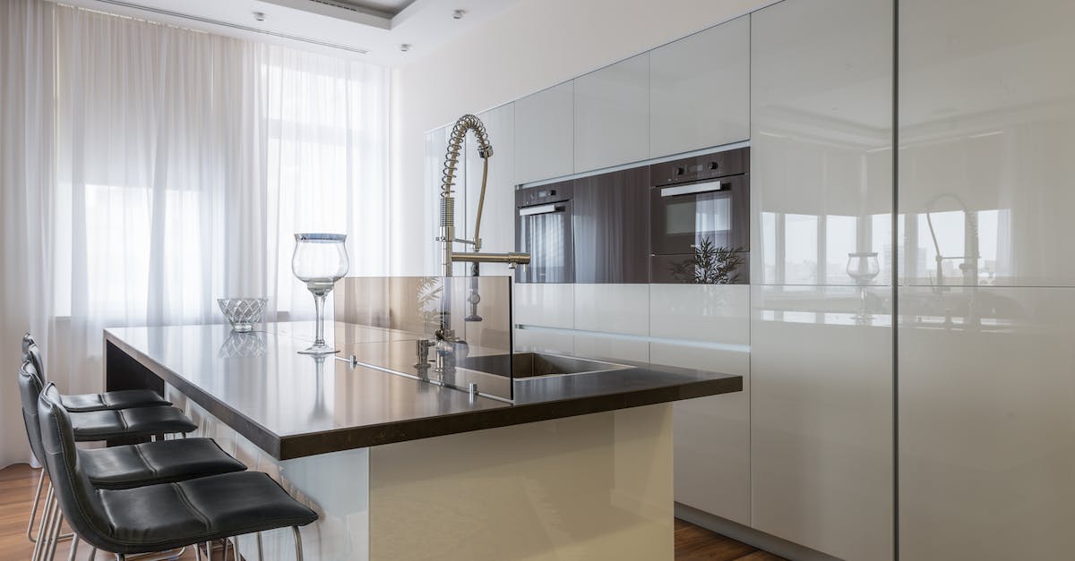 How do I restart on a new island in Battle Islands on PS4? - Minimalist interior of spacious kitchen with built in ovens and island