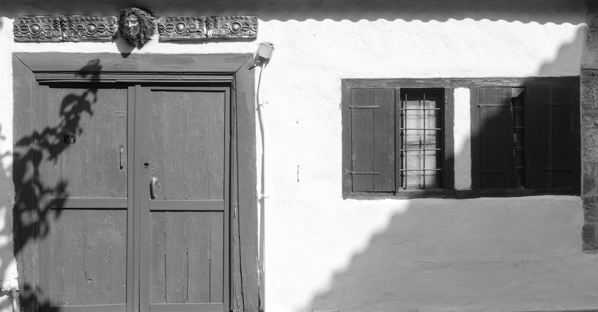 How do I run Facade on Windows 7? - Grayscale Photo of Wooden Door of a Building How do I run Facade on Windows 7? - Grayscale Photo of Wooden Door of a Building
