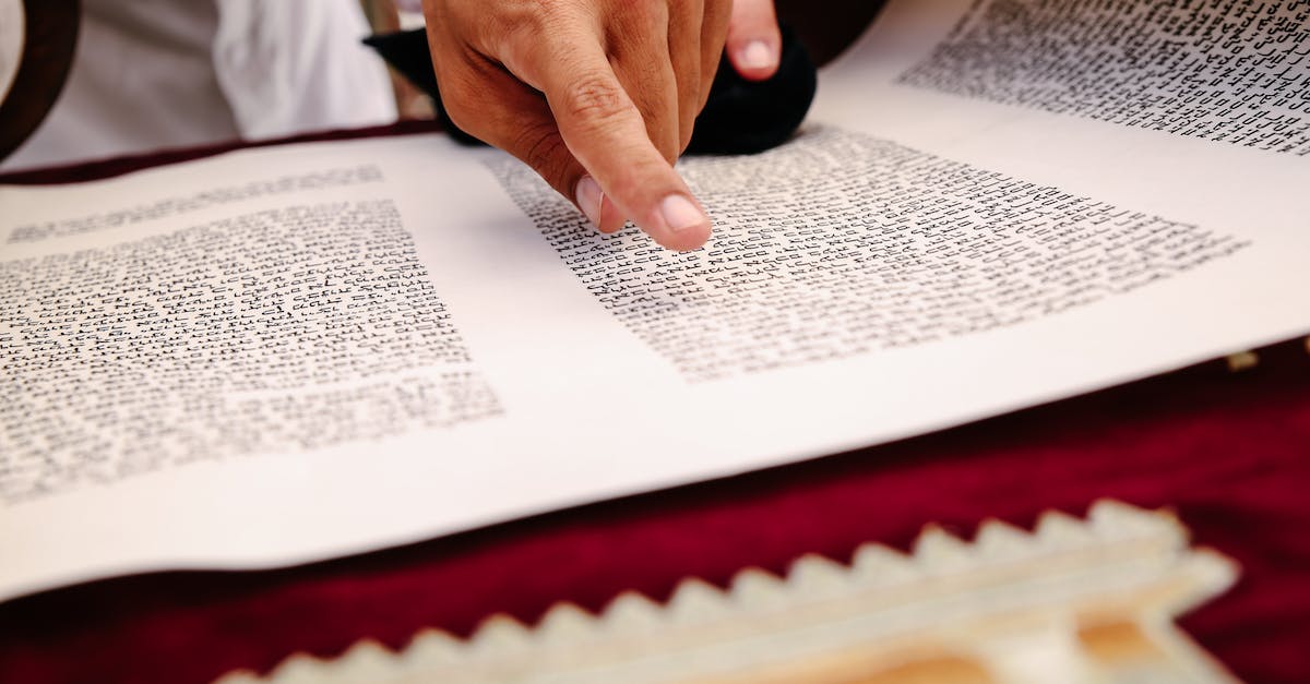 How do I scroll the inventory right in the book store? - Close-up of Person Reading Old Scroll Book How do I scroll the inventory right in the book store? - Close-up of Person Reading Old Scroll Book