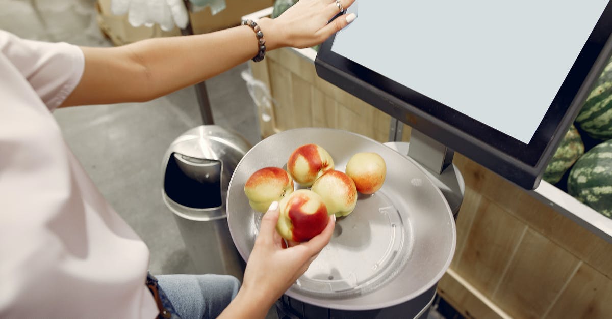 How do I select the attack angle when using a skulljack? - From above of unrecognizable woman touching screen of electronic scales and putting peaches while weighing peaches on scales in contemporary supermarket