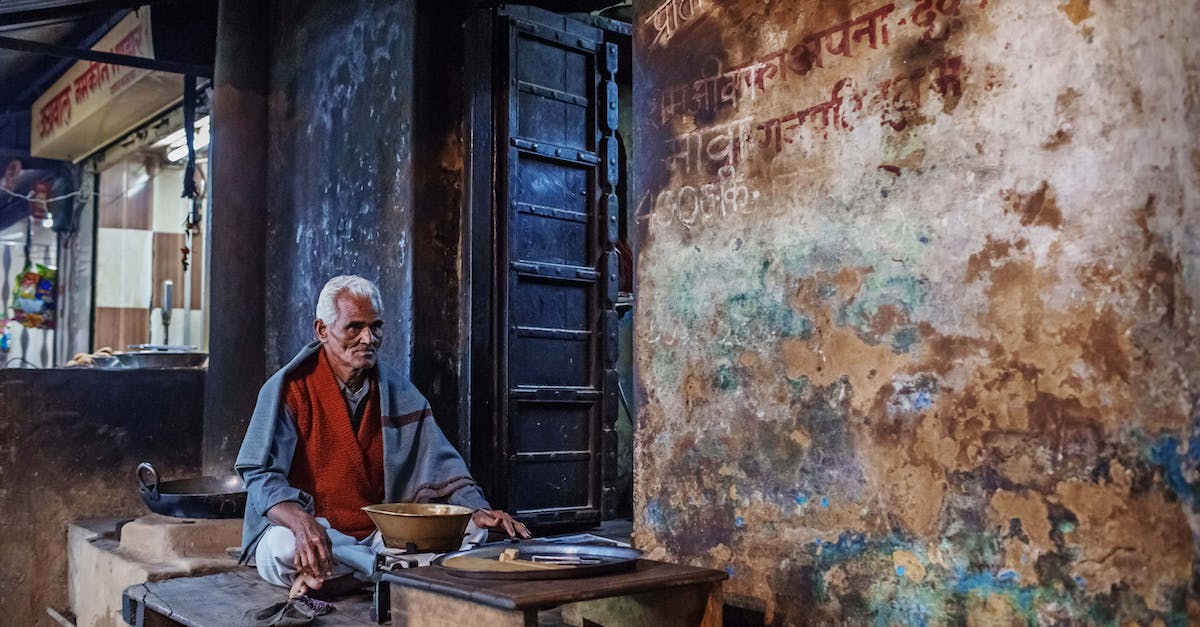 How do I sell my Elder Scrolls? - Elderly ethnic man on local street bazaar How do I sell my Elder Scrolls? - Elderly ethnic man on local street bazaar