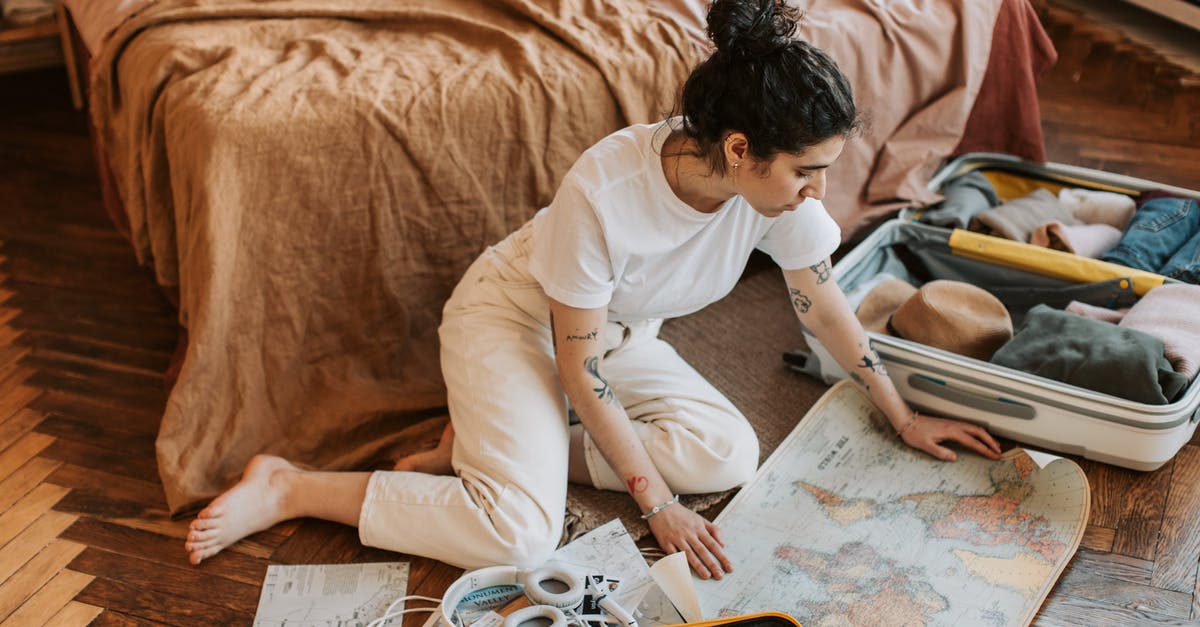 How do I send a custom map to somebody? - Man in White Shirt Writing on White Paper