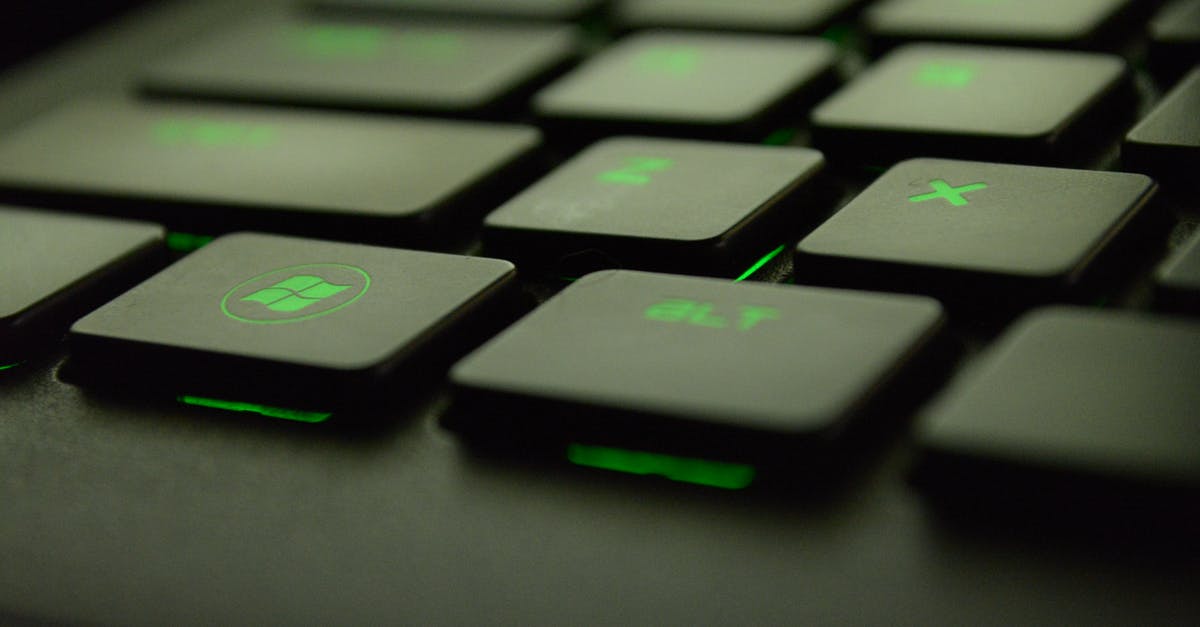 How do I separate which game is installed on Steam based on windows user? - Close-up Photography of Black and Green Computer Keyboard Keys