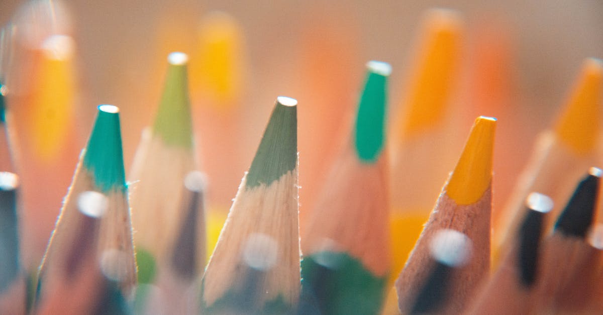 How do I set up a supply line? - Closeup of sharpened multicolored bright pencils set placed in row in art studio