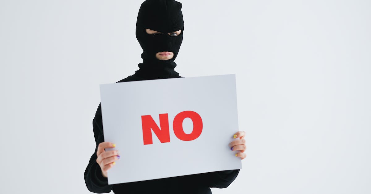 How do I /setblock a sign with text? - Person Holding White and Red Heart Print Card