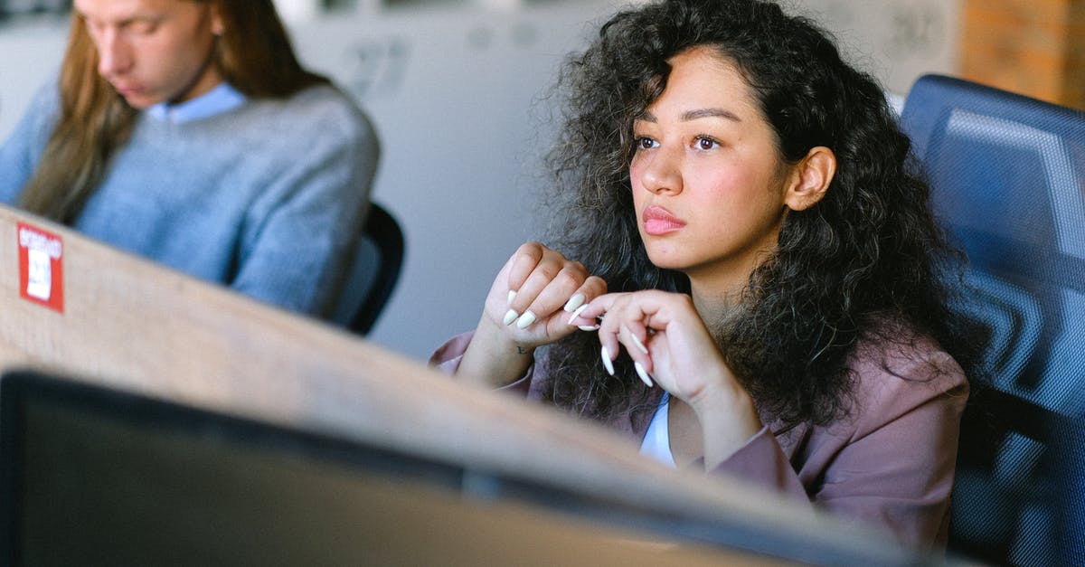 How do I solve level 6 question 52 in Think Different? - High angle of concentrated female employee sitting at table in open space and thoughtfully looking away