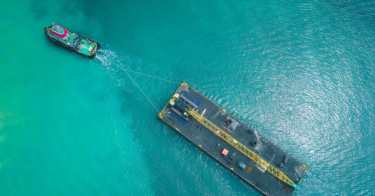 How do I spawn a large platform of lava up at build limit? - Aerial view of modern vessel floating on rippling blue seawater and pulling big platform