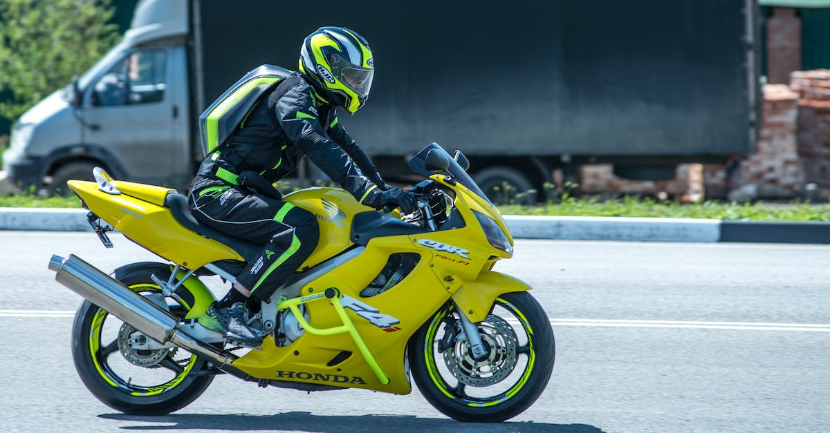 How do I spawn a skeleton with enchanted leather armor riding a creeper? [duplicate] - Person in Black Motorcycle Suit Riding Yellow Sports Bike
