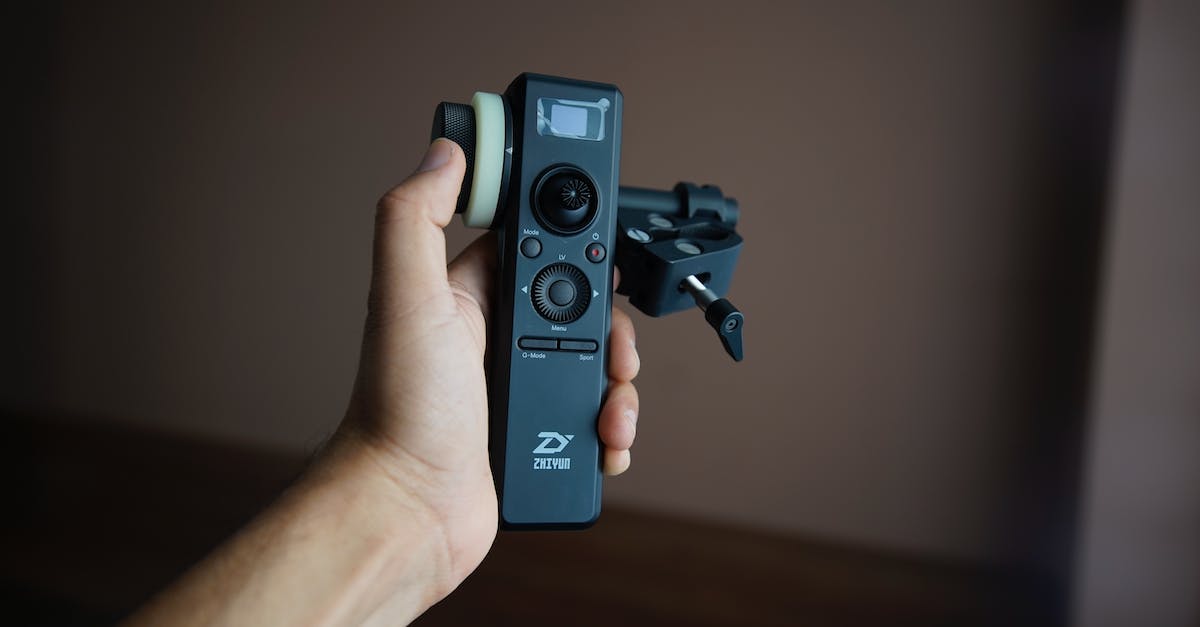 How do I switch to the other side camera of my character? - Hand of person with camera stabilizer control panel How do I switch to the other side camera of my character? - Hand of person with camera stabilizer control panel
