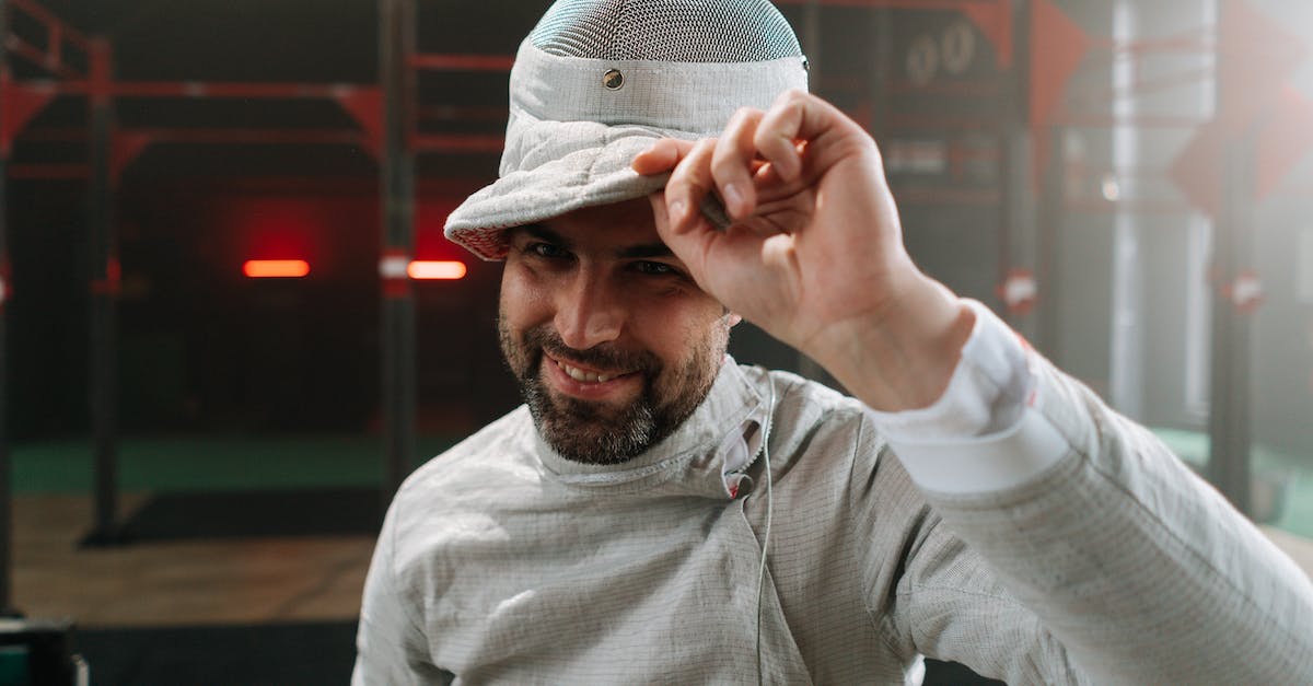 How do I take off a suit in NBA 2K14 my career? - Man taking off fencing mask smiling How do I take off a suit in NBA 2K14 my career? - Man taking off fencing mask smiling