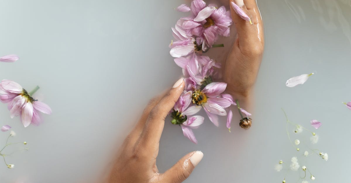 How do I take off body armor? [duplicate] - Woman holding flowers in hands in water