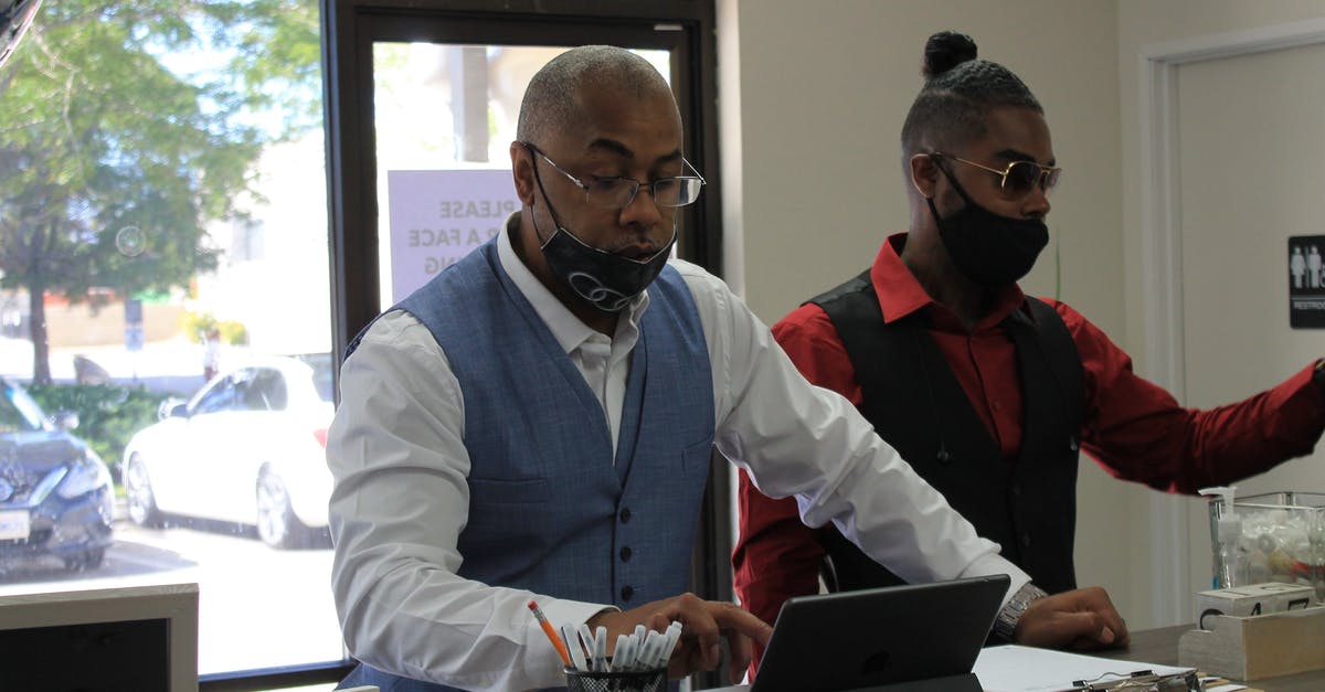 How do I tell which chapter I'm in? - Man Using an iPad Beside His Friend 