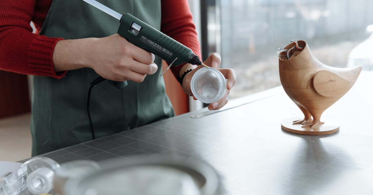 How do I throw an item in The Cave? - Person Pouring Coffee on Brown Ceramic Mug