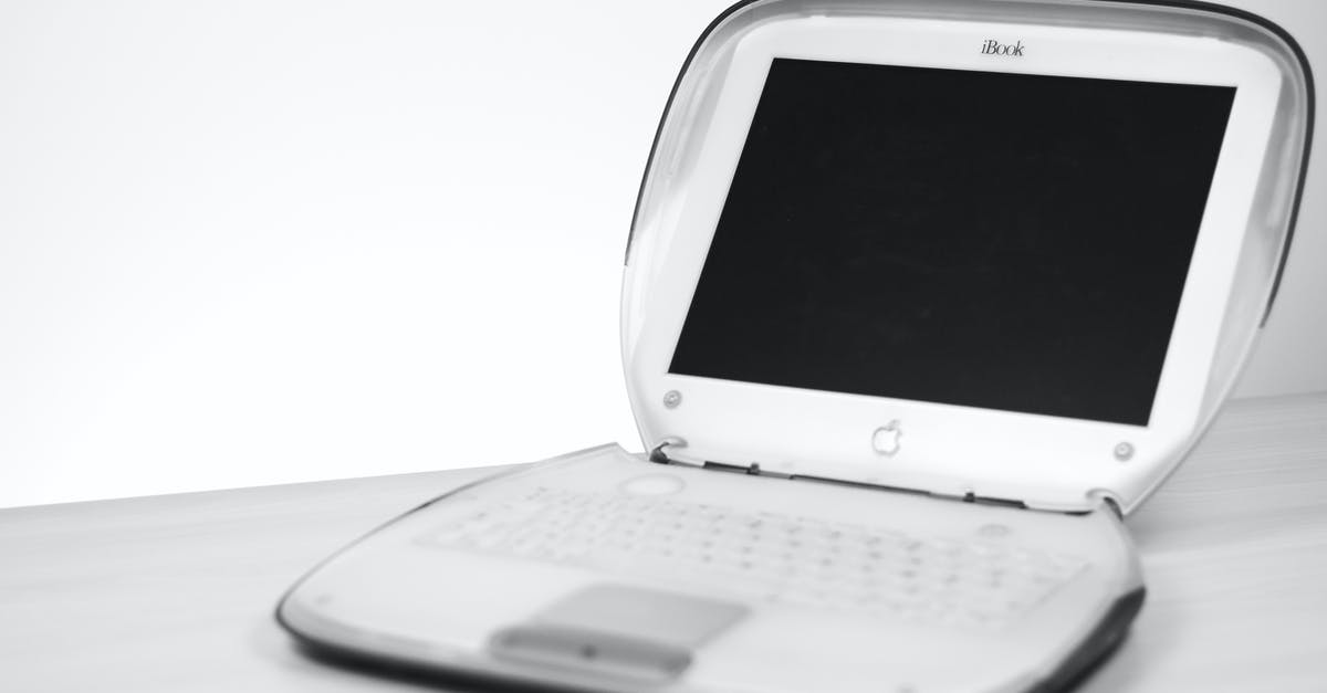 How do I translate the books? - White Apple Laptop on Black Screen on White Surface