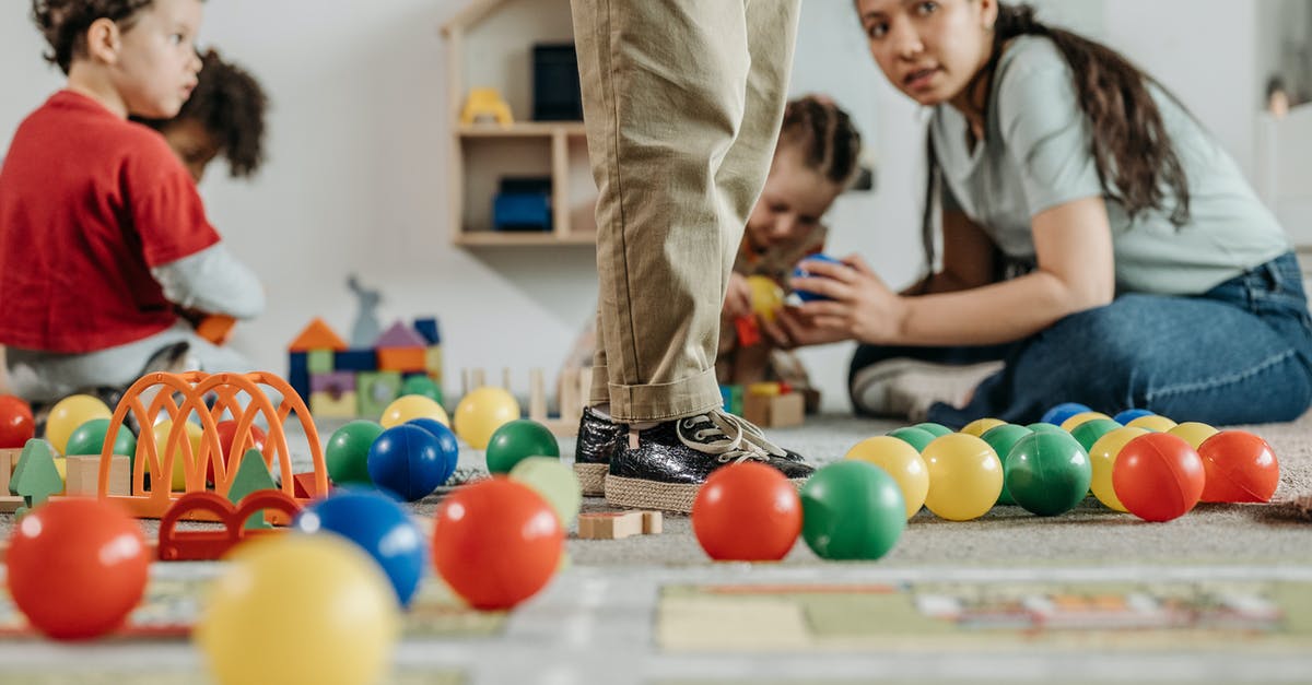How do I unforce bot classes in TF2? - Man in Gray T-shirt and Gray Denim Jeans Standing Beside Girl in Black T-shirt