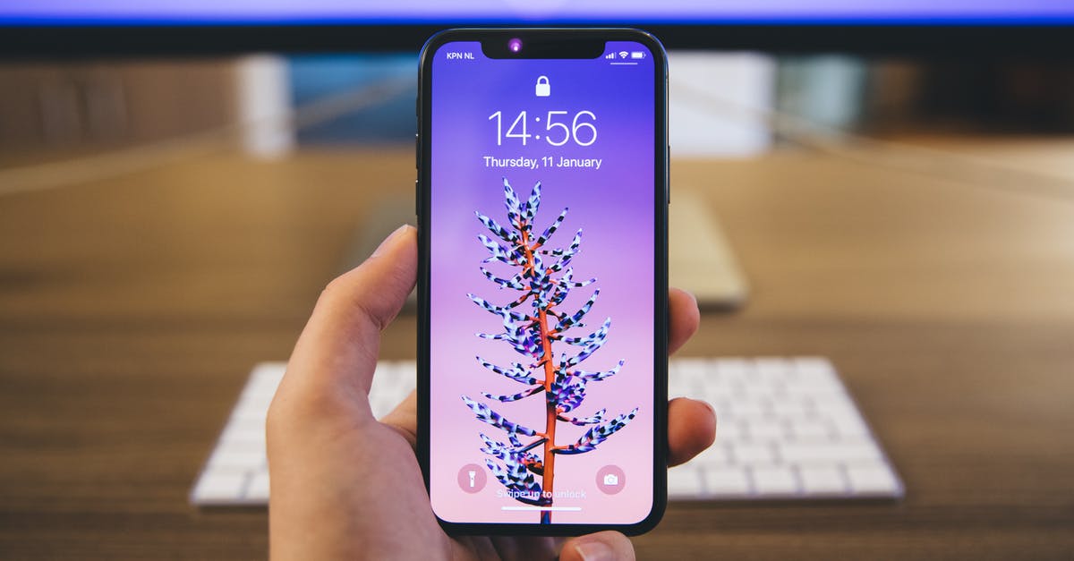 How do I unlock time trials mode? - Person Holds Space Gray Iphone X