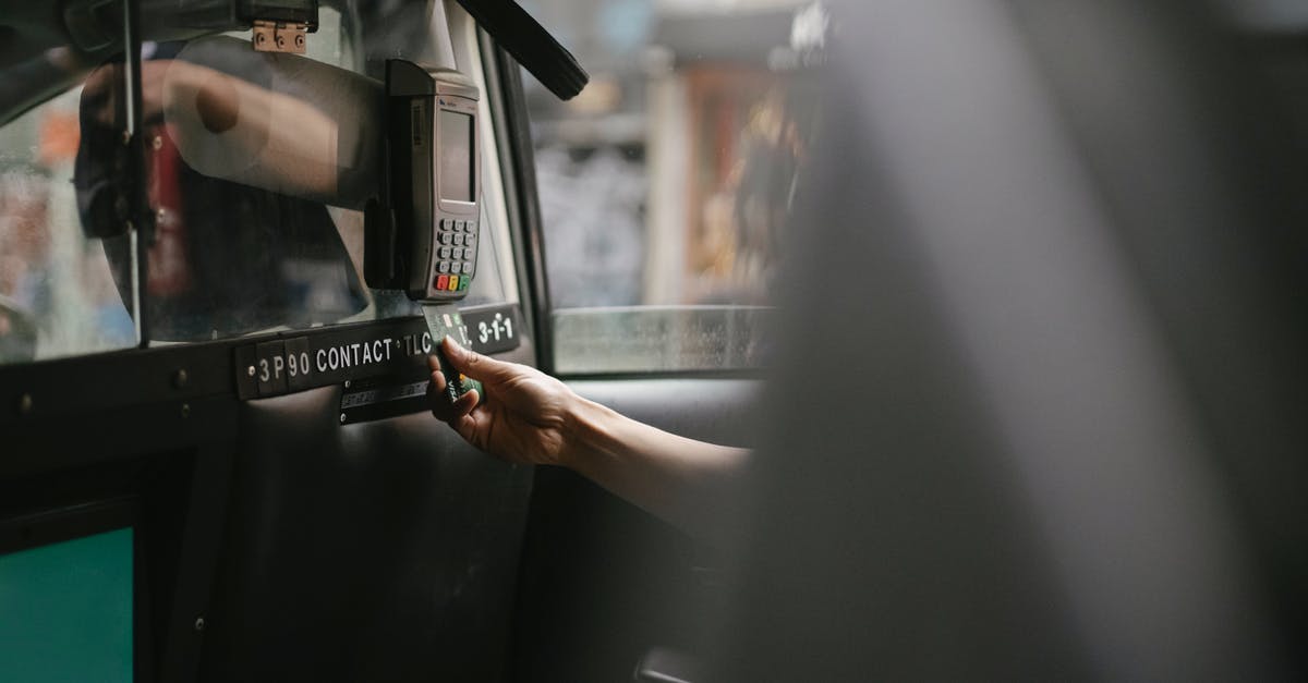 How do I use my second move in Pokemon GO? - Passenger using credit card for paying taxi ride