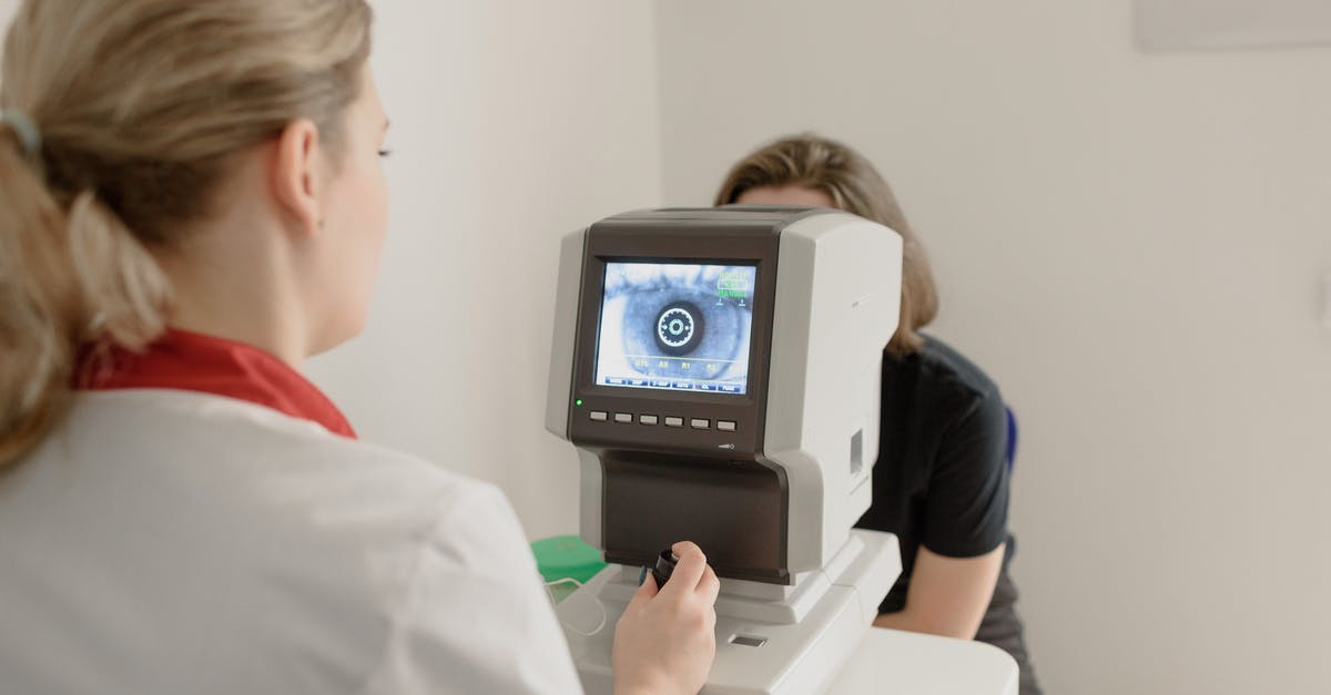 How do I use the medic's shield on Mann vs Machine? - Anonymous oculist examining vision of patient on eye screener
