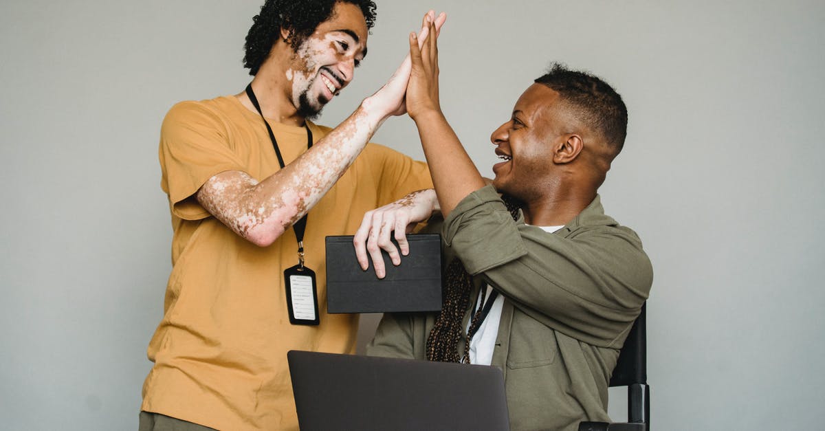 How do I use the RootVehicle tag on other entities in Minecraft? - Positive black colleagues giving high five