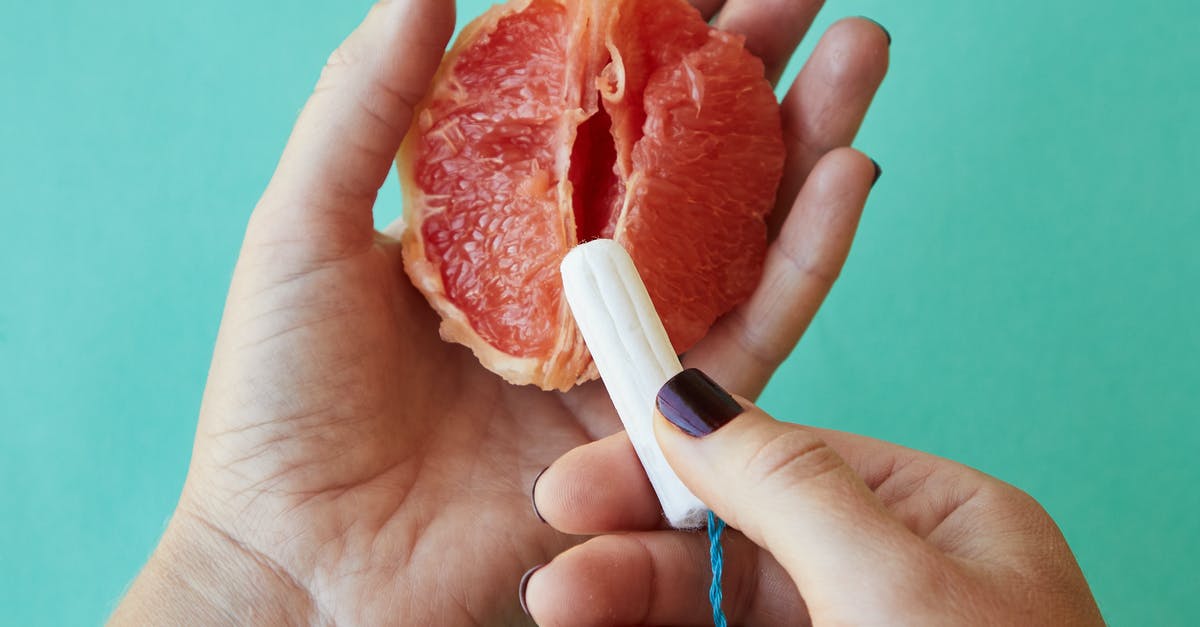 How do I use Triple Notch without triggering High Volley - From above of crop anonymous female demonstrating on sliced ripe grapefruit correct use of tampon against blue background