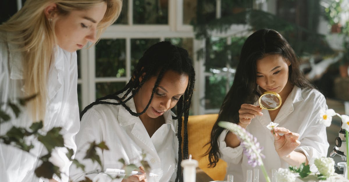 How do labs and scientists work? - Botanists Examining Flowers