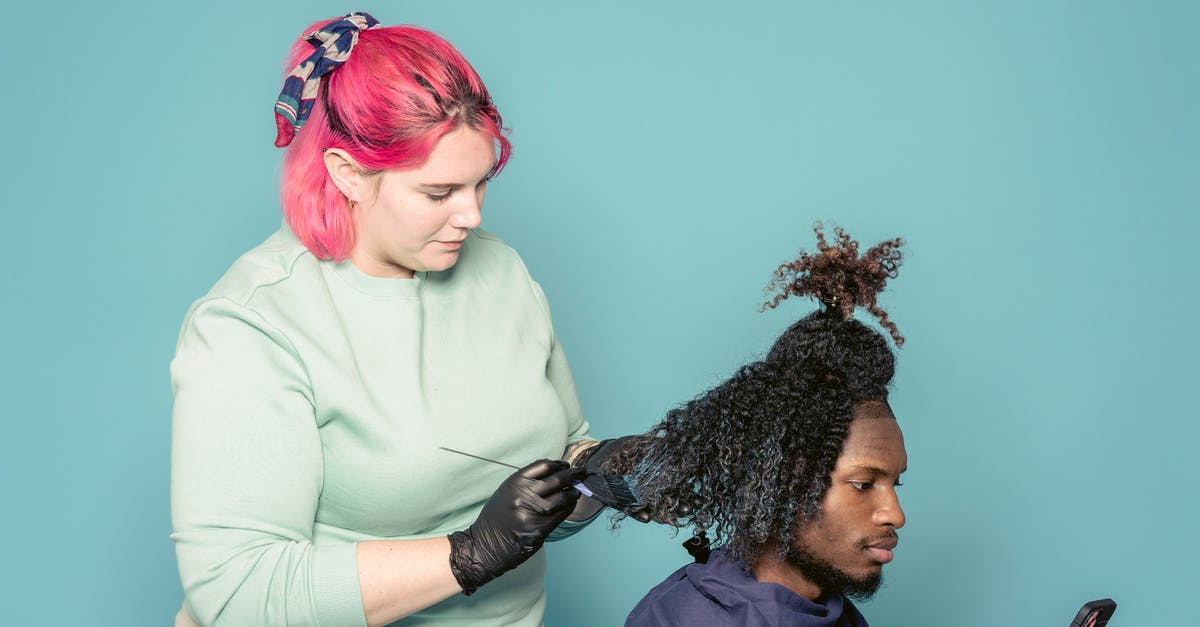 How do multiple Mobile Processing Labs work? - Hairdresser applying paint on hair of black client How do multiple Mobile Processing Labs work? - Hairdresser applying paint on hair of black client