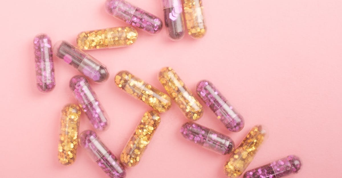 How do NPCs heal our Pokémon? - Pile of sparkling drug capsules scattered on pink surface