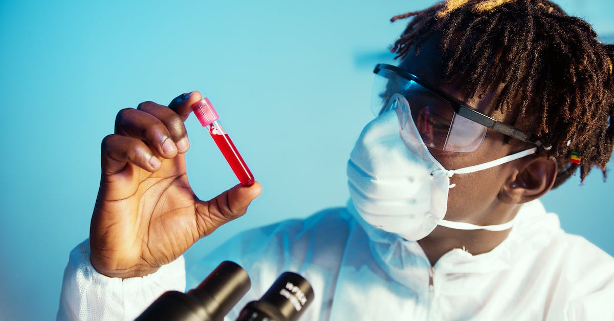 How do save slots work in in Blood Dragon? - A Man Holding a Blood Tube