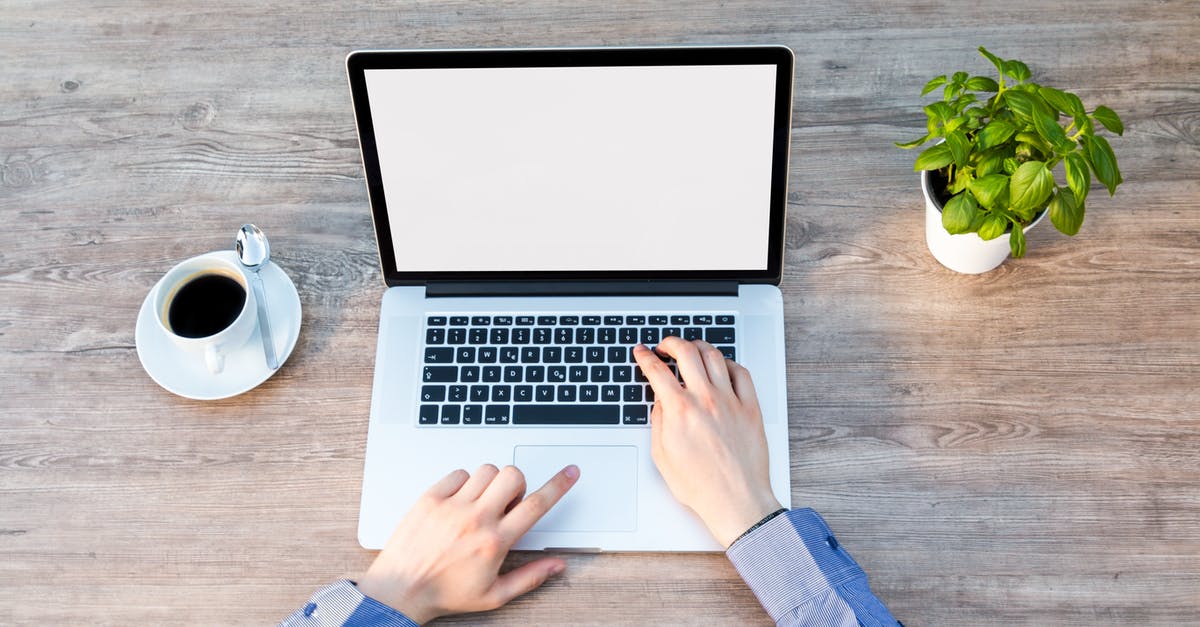 How do Steam download keys work? - Person's Hand on Laptop